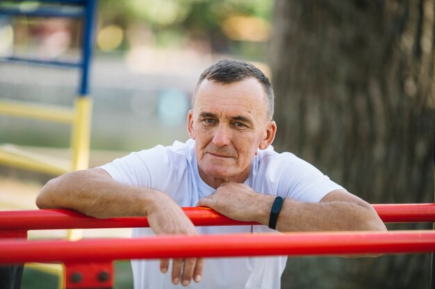 Sportive senior resting after training