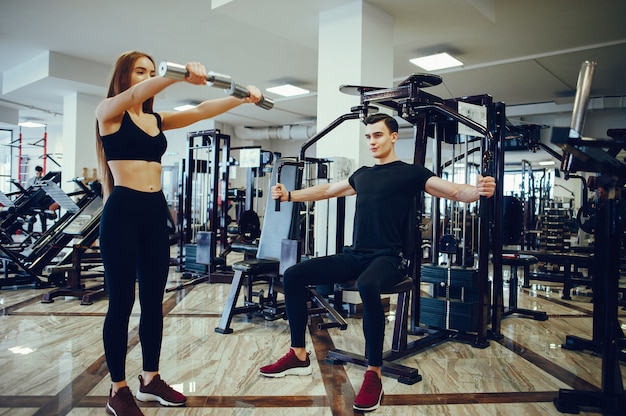 Sports couple in a morning gym