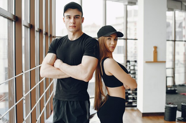 Sports couple in a morning gym