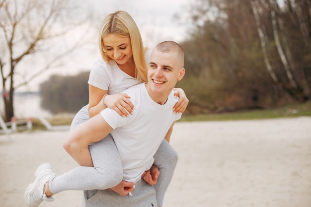 Sports couple in a summer park