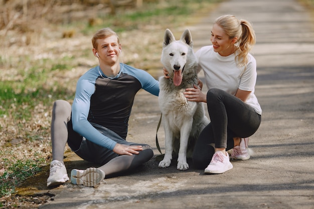 Sports couple training in a summer forest