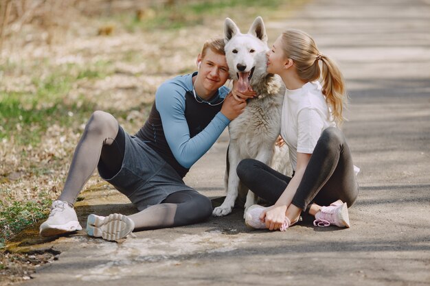 Sports couple training in a summer forest