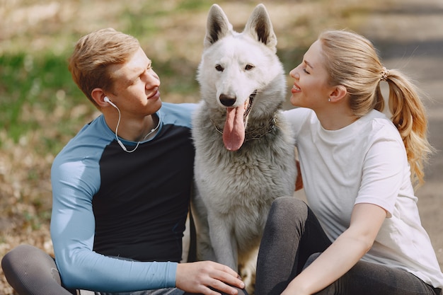 Free photo sports couple training in a summer forest