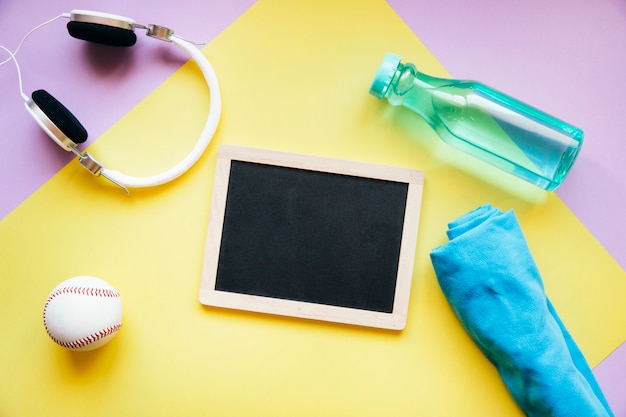 Sports equipment around blackboard