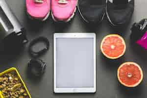 Free photo sports equipment near tablet