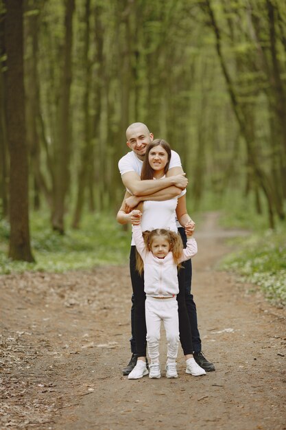 Sports family in a summer forest