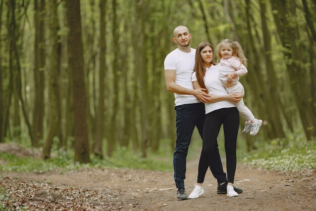 Sports family in a summer forest