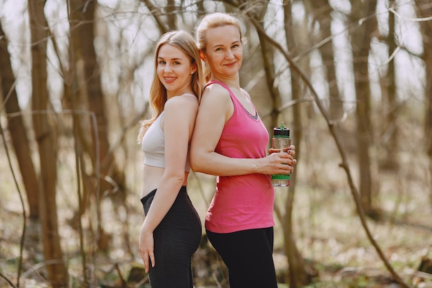 Sports family training in a summer forest