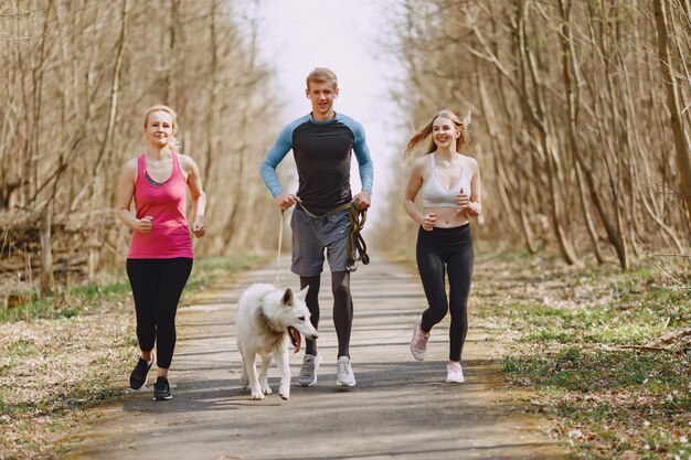 Sports family training in a summer forest