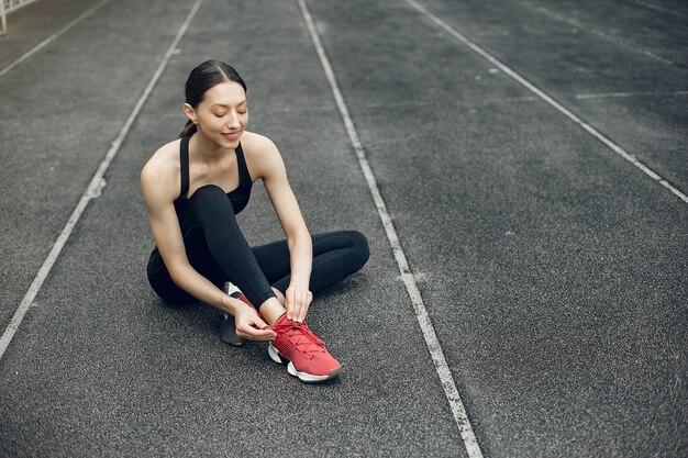 Sports girl training at the stadium