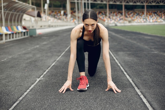 Sports girl training at the stadium