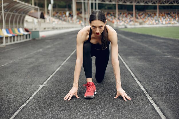 Sports girl training at the stadium