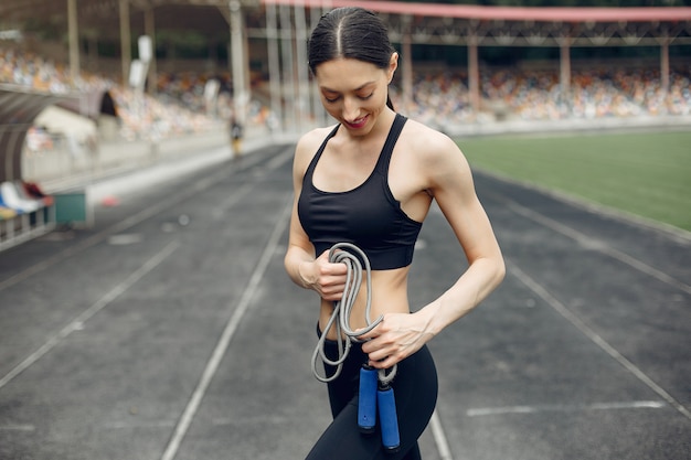 Sports girl training at the stadium