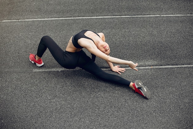 Sports girl training at the stadium