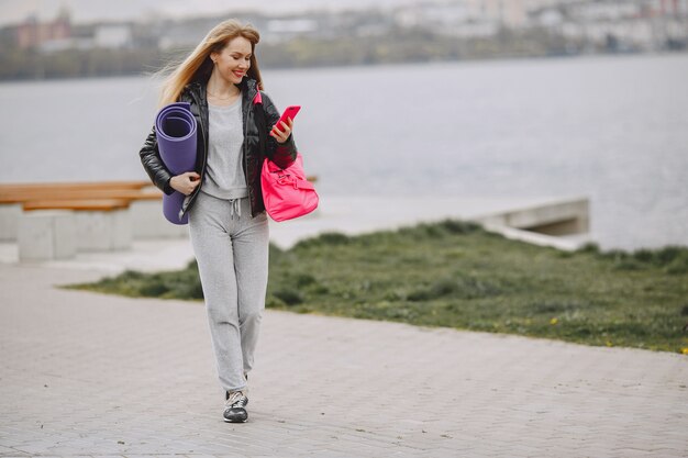 Sports girl training in a summer park