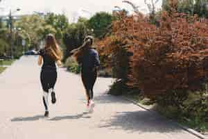 Free photo sports girls training in a summer forest