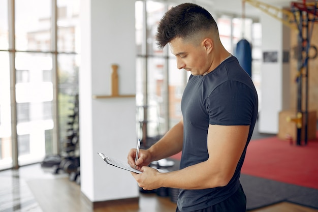 Sports man spend time in a morning gym