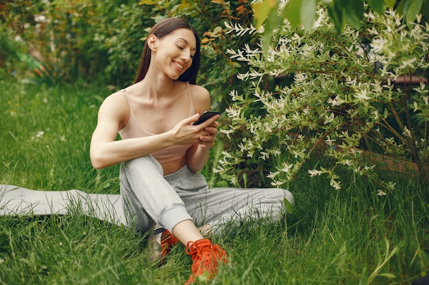 Sports woman spending time in a spring park