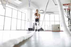 Free photo sports woman training in a morning gym