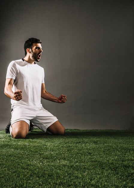 Sportsman celebrating victory and screaming