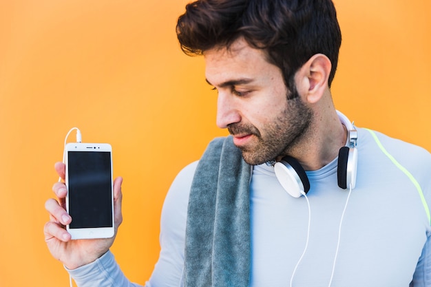 Sportsman looking at smartphone