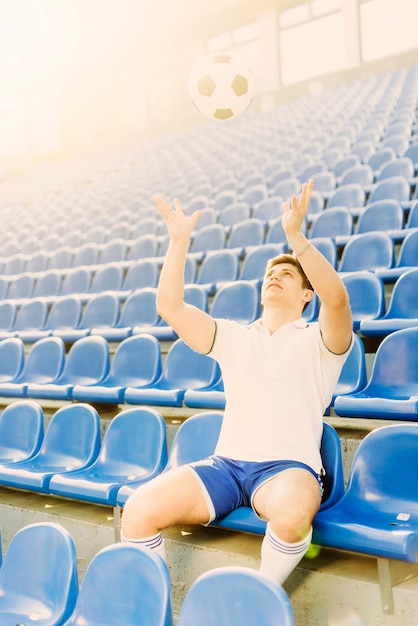 Sportsman throwing soccer ball