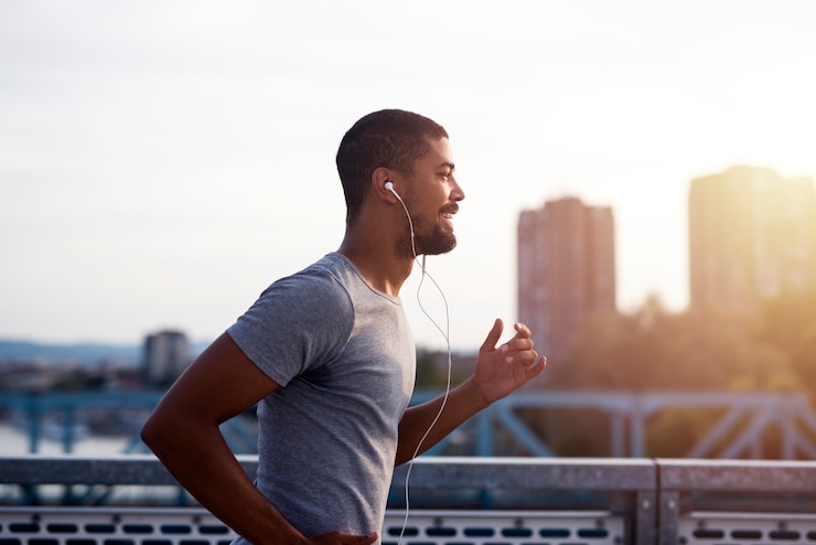 Free Photo sportsman with earphones running and enjoying