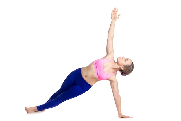 Sportswoman in shape stretching her body