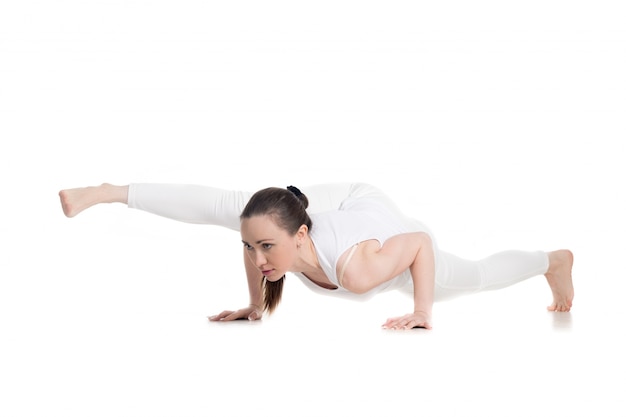 Sportswoman showing a yoga posture