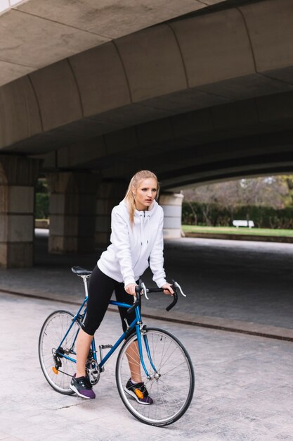 Sportswoman with bicycle