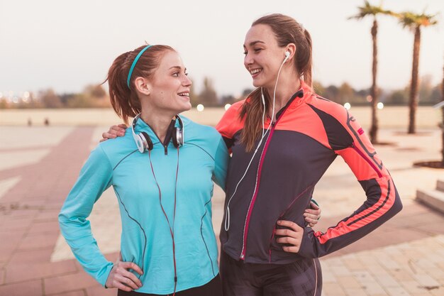 Sportswomen laughing together