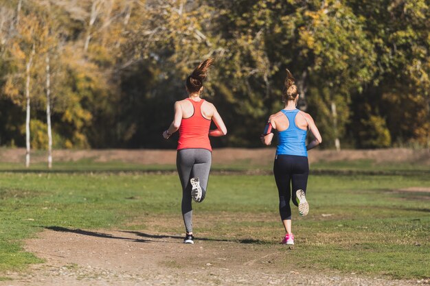 Sportswomen running on a sunny day