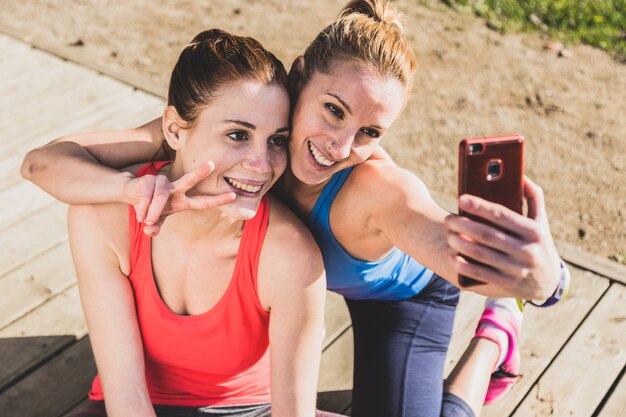 Sportswomen taking a photo