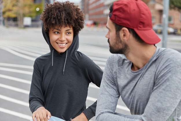 Sporty couple posing in outside setting