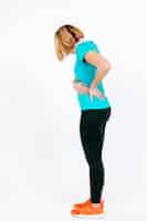 Free photo sporty woman holding hurting waist