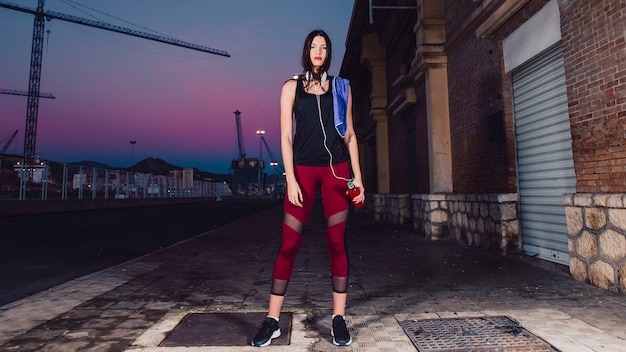 Sporty woman standing on street