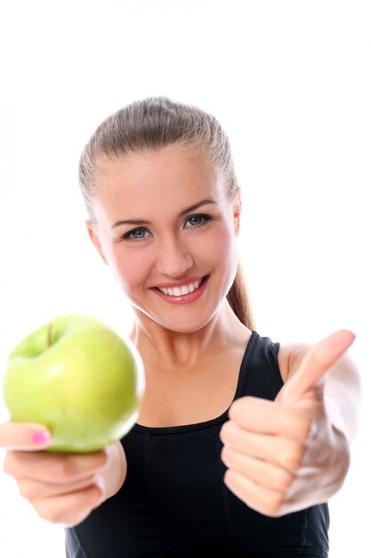 sporty woman with apple