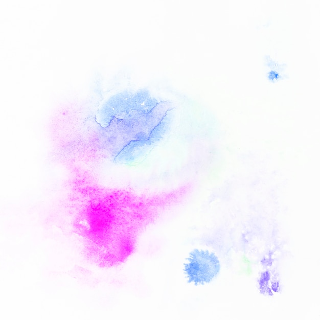 Spots of blue paint near magenta one