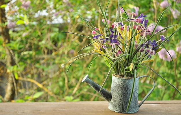 Spring background with watering can