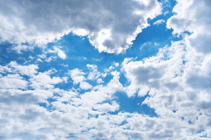 Free Photo spring blue sky with clouds and shape of bird