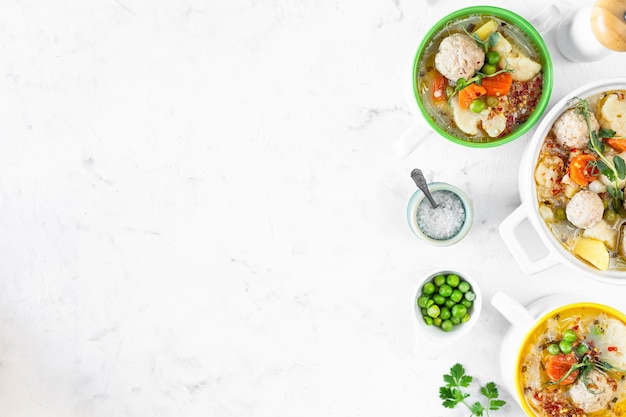 Spring bright soup with meatballs and vegetables Copy space