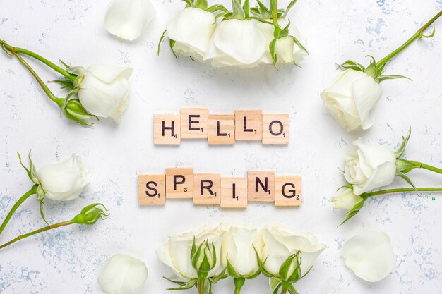 Spring card with white roses and flowers ,top view