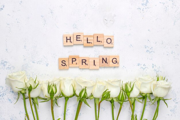 Spring card with white roses and flowers ,top view