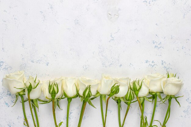 Spring card with white roses and flowers ,top view