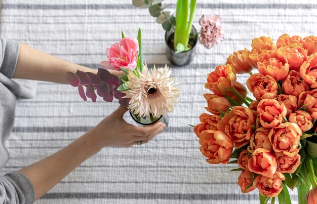 Spring flowers on the table serving and decoration concept top view