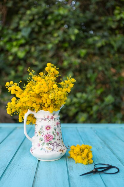 Spring scene with yellow flowers and scissors