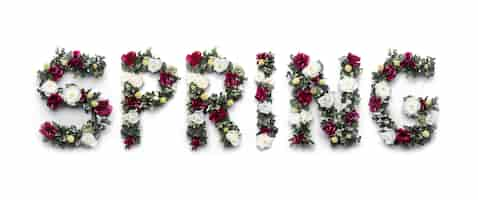 Free photo spring word made of flowers on white