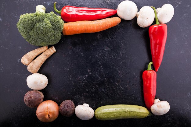 Square of different vegetables on a table with copyspace available