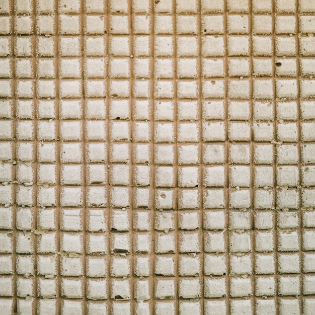 Square pattern on concrete wall backdrop