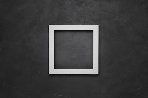 Square white empty frame on gray textured background with copyspace